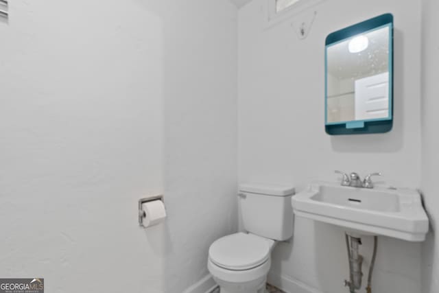 1419 Briarcliff Rd, Macon, GA 31201 - half bathroom featuring baseboards and toilet