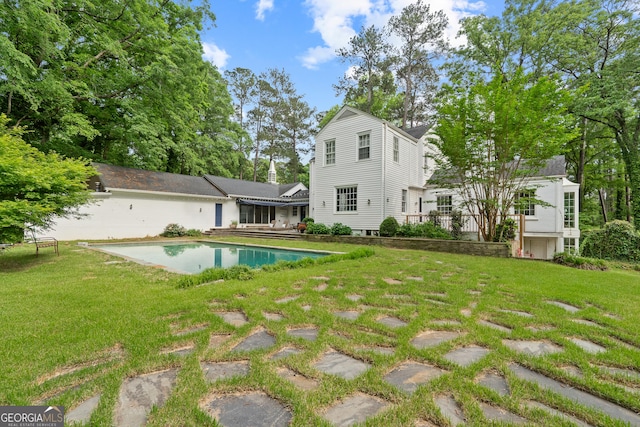 1419 Briarcliff Rd, Macon, GA 31201 - back of property with a lawn and an outdoor pool