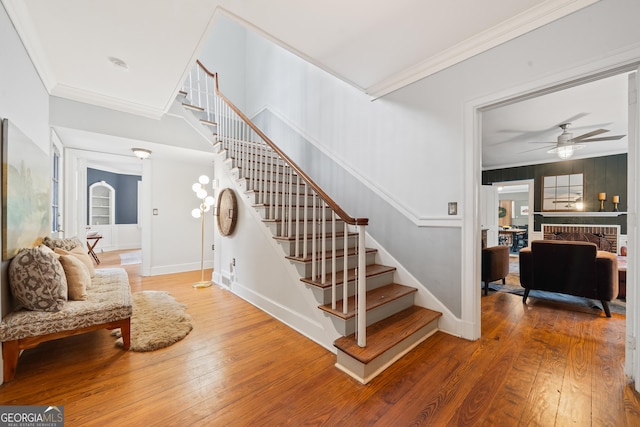 1419 Briarcliff Rd, Macon, GA 31201 - staircase with hardwood / wood-style floors, a ceiling fan, baseboards, and crown molding