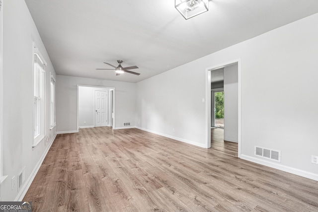 851 Rockbridge Rd SW, Lilburn, GA 30047 - empty room featuring wood finished floors, visible vents, and baseboards