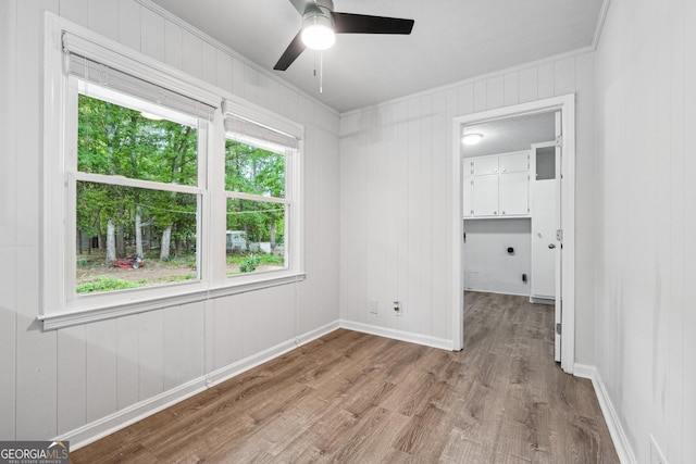 851 Rockbridge Rd SW, Lilburn, GA 30047 - unfurnished room featuring wood finished floors, a ceiling fan, ornamental molding, and baseboards