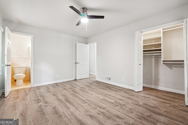 851 Rockbridge Rd SW, Lilburn, GA 30047 - unfurnished bedroom featuring baseboards, visible vents, wood finished floors, and a closet