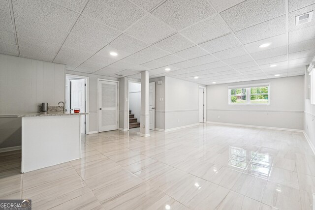 851 Rockbridge Rd SW, Lilburn, GA 30047 - interior space featuring light tile patterned floors, visible vents, stairway, and baseboards