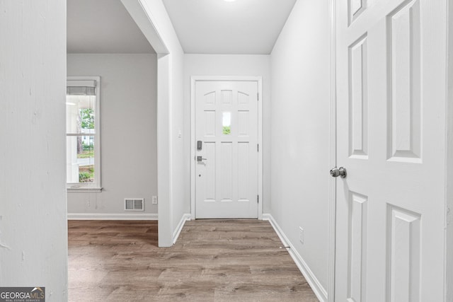 851 Rockbridge Rd SW, Lilburn, GA 30047 - entryway with wood finished floors, visible vents, and baseboards