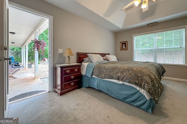 bedroom featuring lofted ceiling, ceiling fan, access to exterior, baseboards, and carpet floors