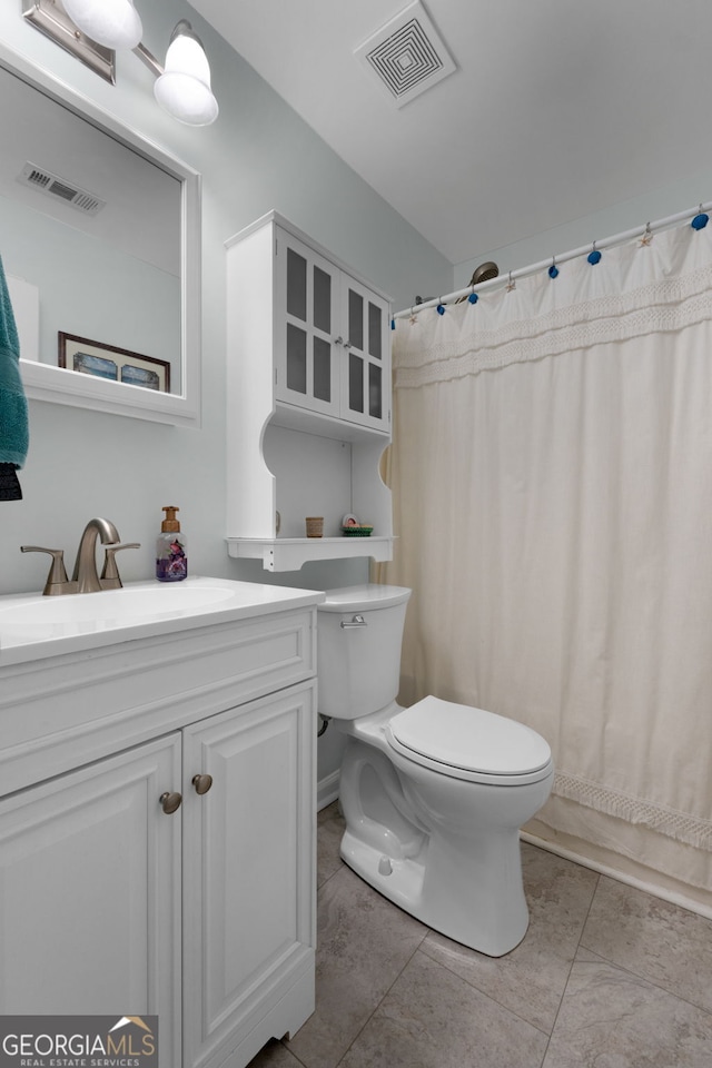full bathroom with visible vents, toilet, and tile patterned floors