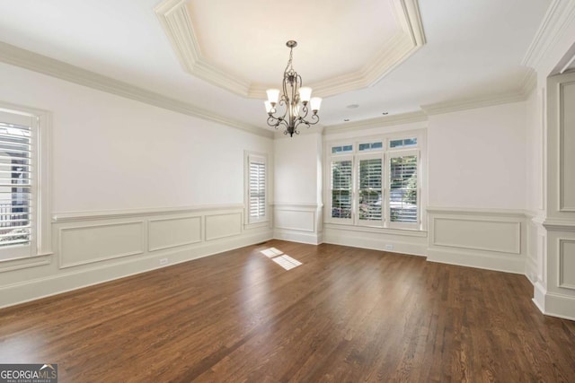 2480 Flint Creek Dr, Cumming, GA 30041 - unfurnished room with crown molding, wood finished floors, wainscoting, a chandelier, and a raised ceiling