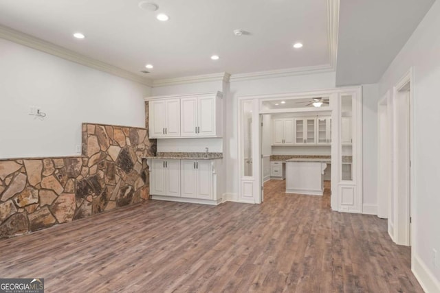 2480 Flint Creek Dr, Cumming, GA 30041 - kitchen featuring white cabinets, crown molding, wood finished floors, and recessed lighting