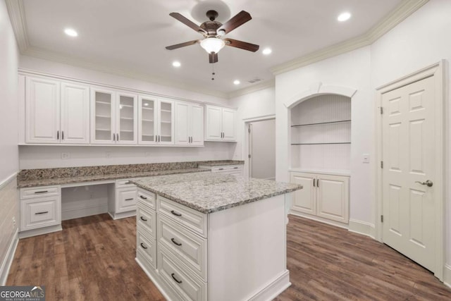 2480 Flint Creek Dr, Cumming, GA 30041 - kitchen with white cabinetry, ornamental molding, a center island, and ceiling fan