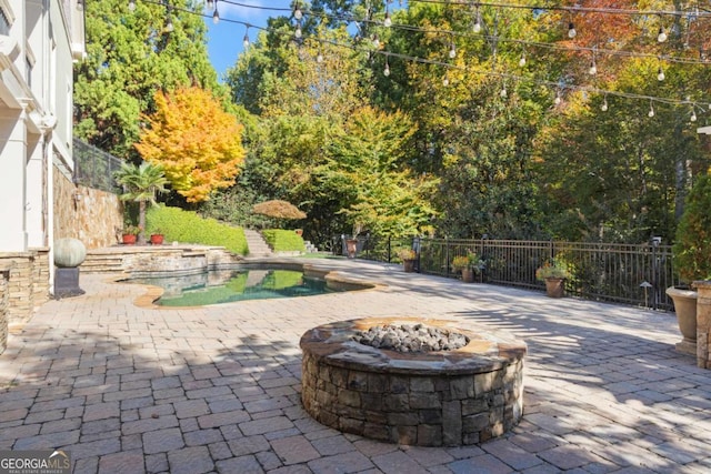 2480 Flint Creek Dr, Cumming, GA 30041 - view of patio with a fenced in pool and an outdoor fire pit