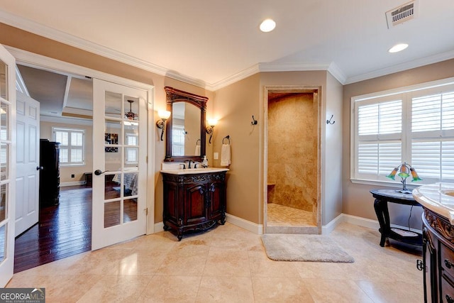 full bath featuring visible vents, baseboards, and tiled shower