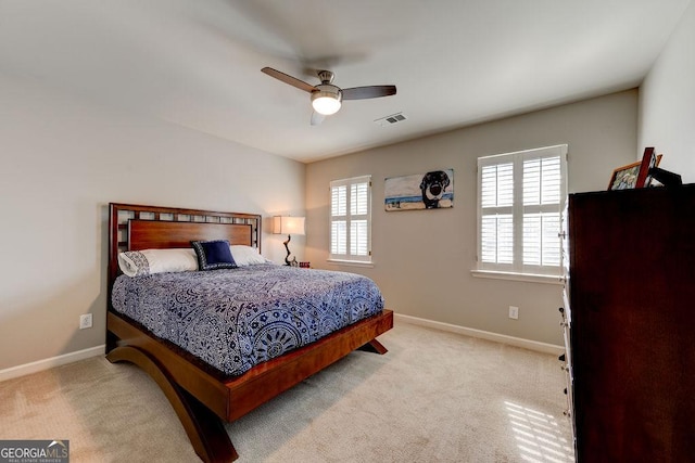 bedroom featuring carpet flooring, visible vents, and baseboards