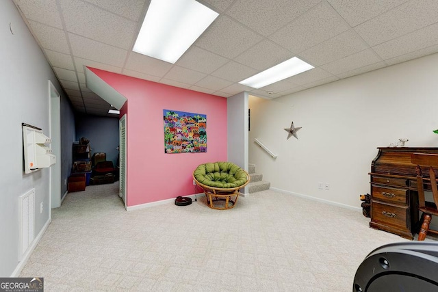 office with visible vents, a paneled ceiling, carpet flooring, and baseboards