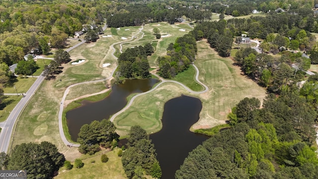 bird's eye view with view of golf course and a water view