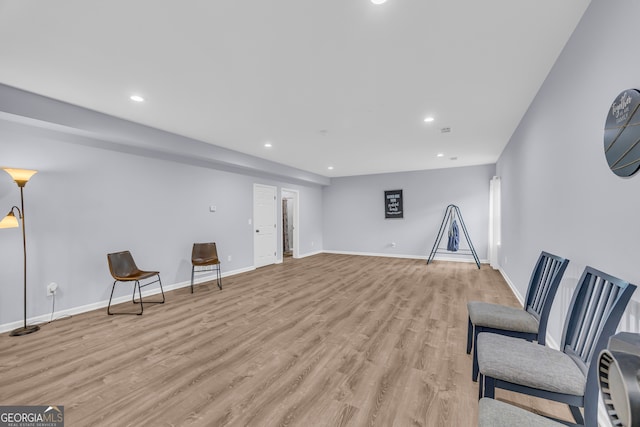 unfurnished room featuring light wood-style floors, recessed lighting, and baseboards