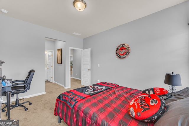 carpeted bedroom with baseboards and visible vents