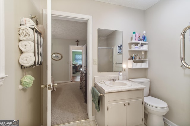 bathroom with baseboards, an enclosed shower, toilet, and vanity