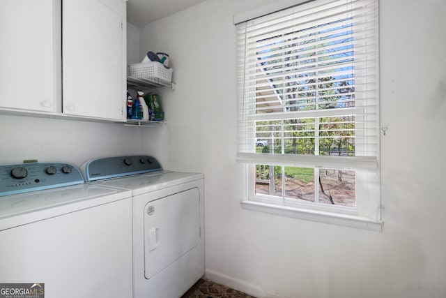 laundry area with washing machine and dryer and cabinet space