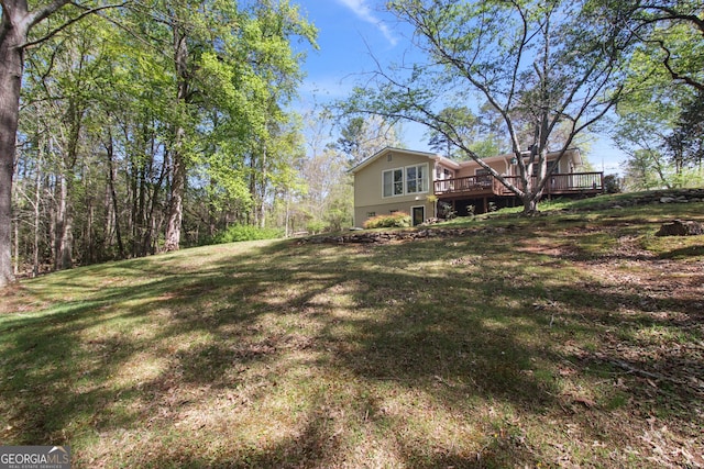 view of yard with a wooden deck