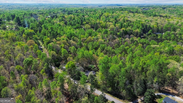 bird's eye view featuring a forest view