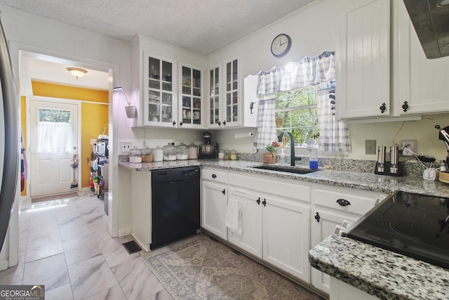 kitchen with white cabinets, glass insert cabinets, black dishwasher, and a sink