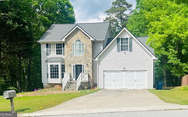 2317 Rocksram Ct, Buford, GA 30519 - colonial-style house with a garage, a front yard, driveway, and stone siding