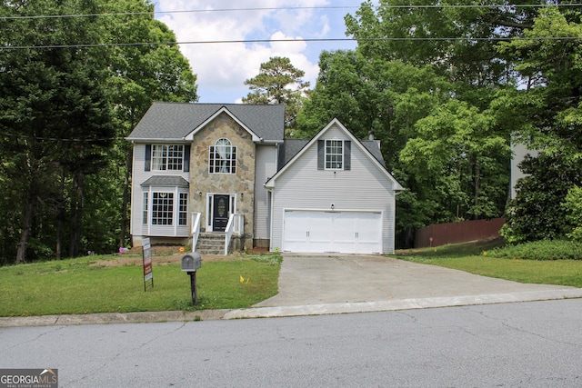 2317 Rocksram Ct, Buford, GA 30519 - colonial-style house featuring fence, a front yard, driveway, and stone siding