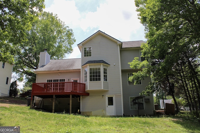 2317 Rocksram Ct, Buford, GA 30519 - back of house featuring a shingled roof, a wooden deck, a yard, and a chimney