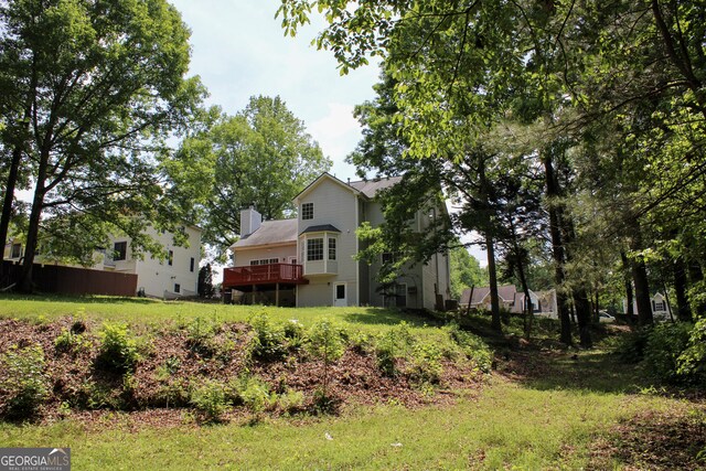 2317 Rocksram Ct, Buford, GA 30519 - back of house with a chimney and a deck