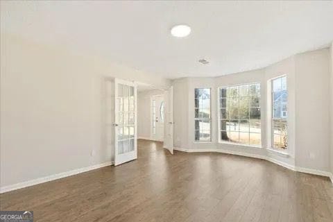 2317 Rocksram Ct, Buford, GA 30519 - interior space featuring baseboards and dark wood-type flooring