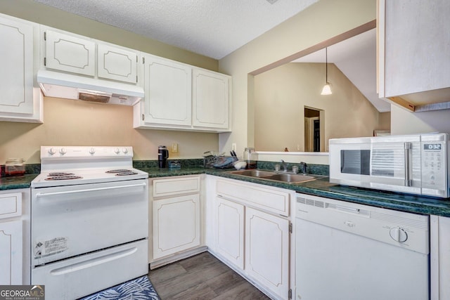 108 Magnolia Plantation Trce Unit 108, Hinesville, GA 31313 - kitchen with dark countertops, a sink, under cabinet range hood, and white appliances