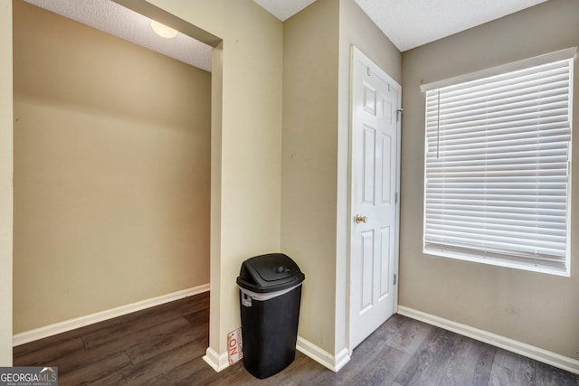 108 Magnolia Plantation Trce Unit 108, Hinesville, GA 31313 - foyer with baseboards, a textured ceiling, and dark wood-style floors