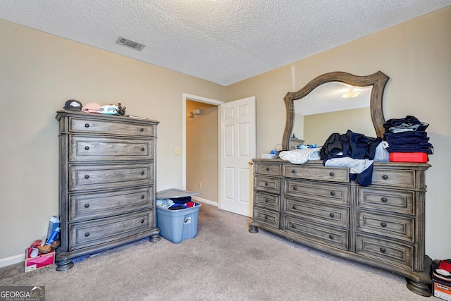 108 Magnolia Plantation Trce Unit 108, Hinesville, GA 31313 - bedroom with carpet floors, a textured ceiling, visible vents, and baseboards