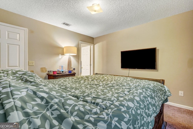 108 Magnolia Plantation Trce Unit 108, Hinesville, GA 31313 - carpeted bedroom featuring a textured ceiling, visible vents, and baseboards