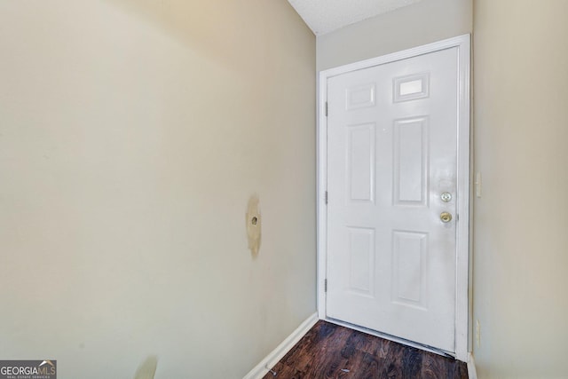 108 Magnolia Plantation Trce Unit 108, Hinesville, GA 31313 - entryway featuring baseboards and dark wood-type flooring