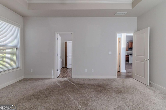 440 Dublin Way, Dallas, GA 30132 - unfurnished bedroom featuring a raised ceiling, carpet, visible vents, and crown molding