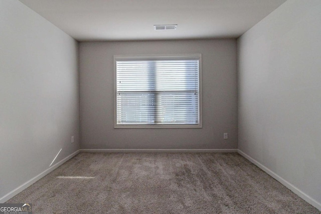 440 Dublin Way, Dallas, GA 30132 - carpeted empty room with baseboards and visible vents