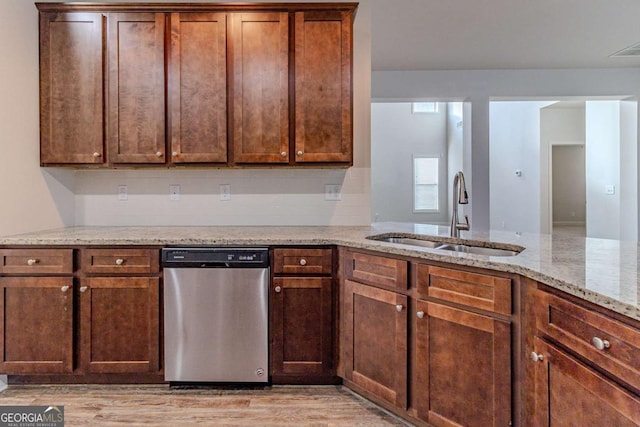440 Dublin Way, Dallas, GA 30132 - kitchen with light stone counters, visible vents, stainless steel dishwasher, a sink, and light wood-type flooring
