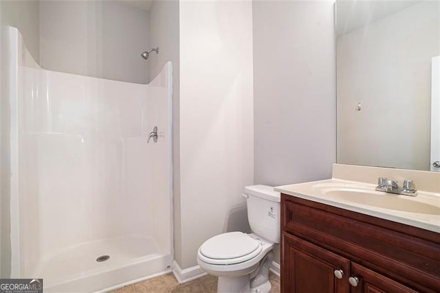 2212 Reddy Farm Ln, Grayson, GA 30017 - bathroom with tile patterned flooring, toilet, vanity, baseboards, and a shower