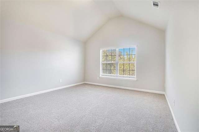 2212 Reddy Farm Ln, Grayson, GA 30017 - carpeted empty room featuring lofted ceiling, baseboards, and visible vents