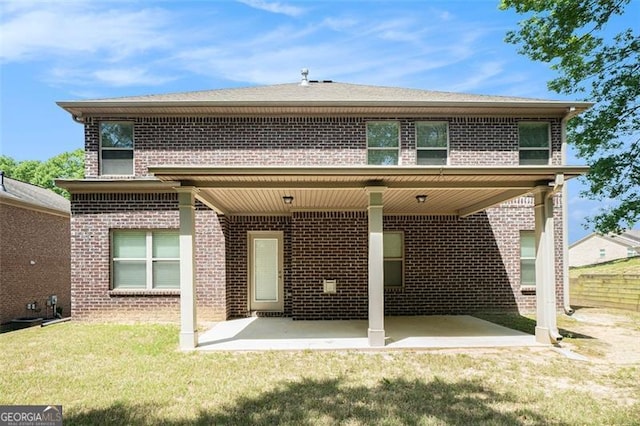 2212 Reddy Farm Ln, Grayson, GA 30017 - back of property with brick siding, a yard, and a patio