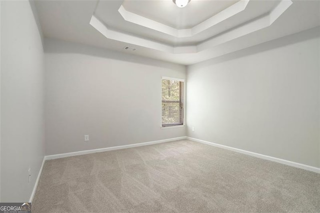 2212 Reddy Farm Ln, Grayson, GA 30017 - empty room featuring baseboards, a tray ceiling, and carpet flooring