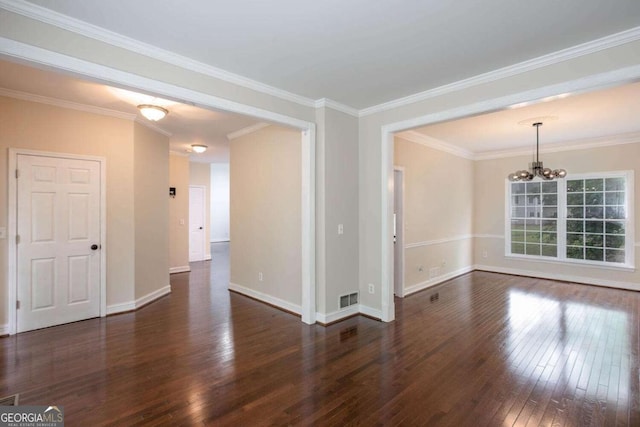 1533 Fallen Leaf Dr SW, Marietta, GA 30064 - empty room with baseboards, visible vents, a notable chandelier, hardwood / wood-style floors, and ornamental molding