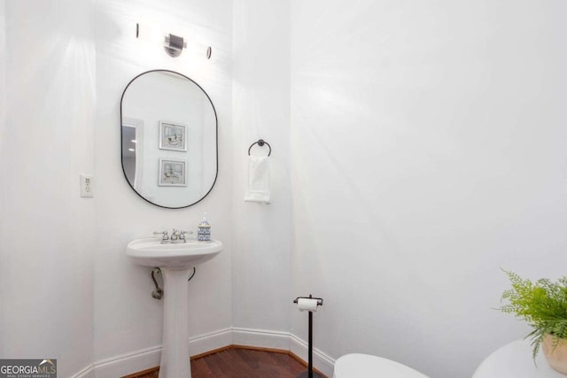 1533 Fallen Leaf Dr SW, Marietta, GA 30064 - half bath with baseboards, wood finished floors, and toilet