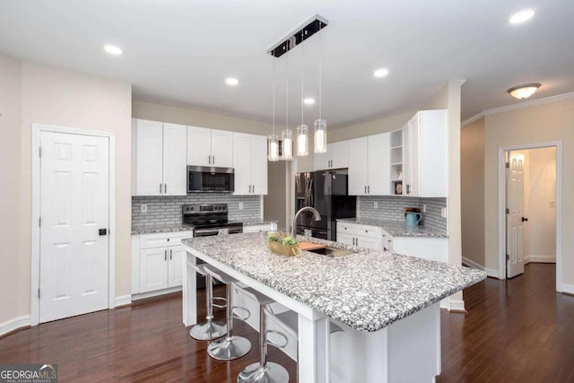1533 Fallen Leaf Dr SW, Marietta, GA 30064 - kitchen with open shelves, a sink, decorative backsplash, a kitchen bar, and appliances with stainless steel finishes