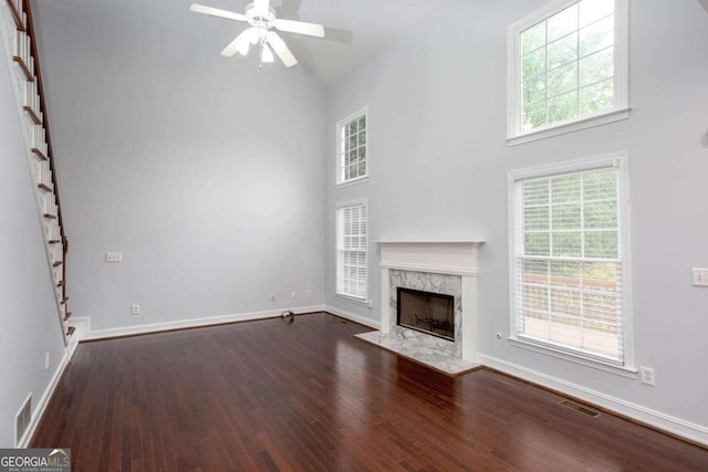 1533 Fallen Leaf Dr SW, Marietta, GA 30064 - unfurnished living room featuring a high end fireplace, visible vents, and a towering ceiling