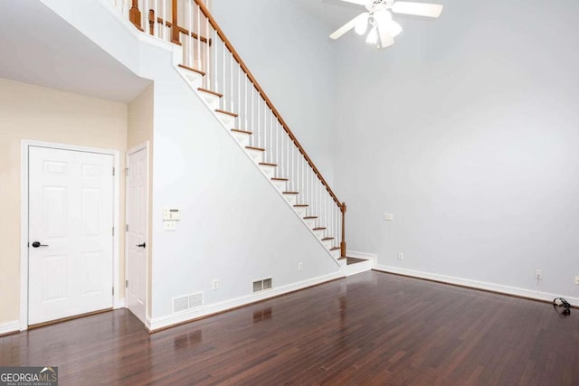 1533 Fallen Leaf Dr SW, Marietta, GA 30064 - unfurnished living room featuring stairway, wood finished floors, visible vents, baseboards, and ceiling fan