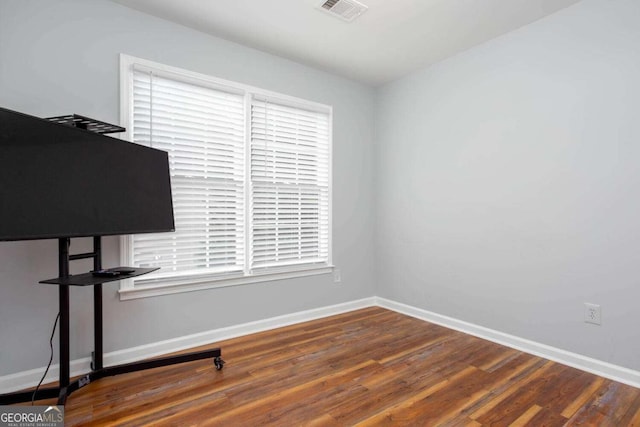 1533 Fallen Leaf Dr SW, Marietta, GA 30064 - spare room featuring wood finished floors, visible vents, and baseboards