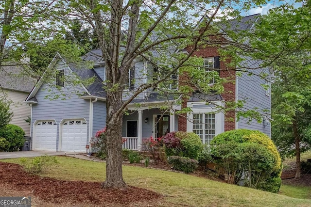 1533 Fallen Leaf Dr SW, Marietta, GA 30064 - traditional-style house featuring a front lawn, driveway, and a porch