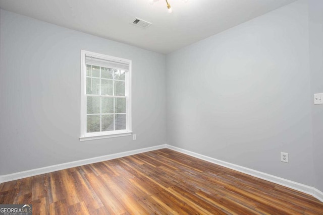 1533 Fallen Leaf Dr SW, Marietta, GA 30064 - empty room with dark wood-style floors, baseboards, and visible vents